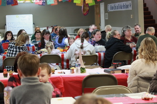 The Fairview church family sharing a meal together